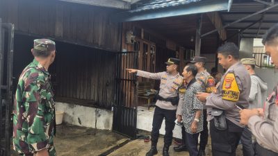 Di Tengah Kepulan Asap Kehadiran Polisi Menenangkan Warga Lok Bahu